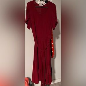 Red ruffled hem dress with built in cloth waist tie.
